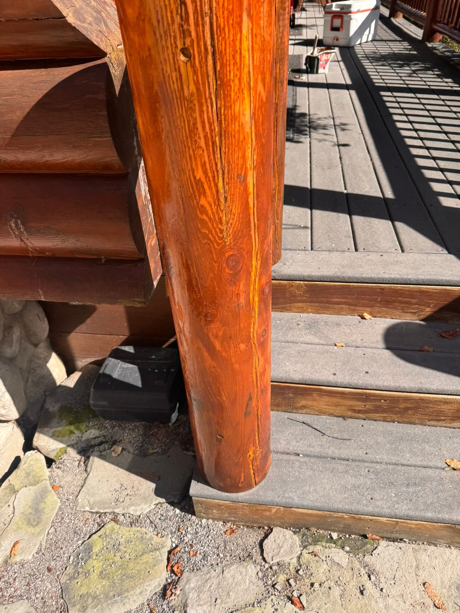 Close-up of a freshly stained log home support post with rich ProLuxe semi-transparent finish